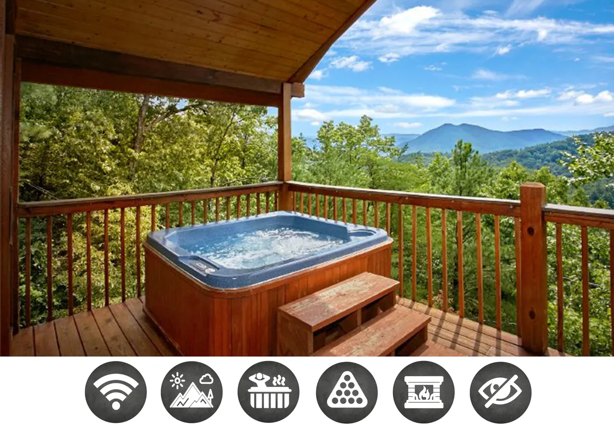 The image showcases a charming wooden cabin perched on a private deck, with a bubbling hot tub overlooking sweeping, sunset-lit mountain views. Lush greenery surrounds the cabin, and the inviting deck offers space for relaxation and soaking in the stunning Smoky Mountains scenery.